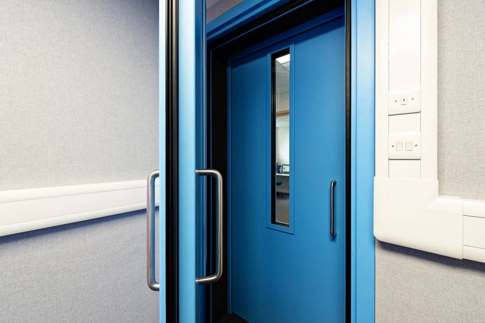 STC-rated acoustic commercial door installed in a Canadian healthcare facility