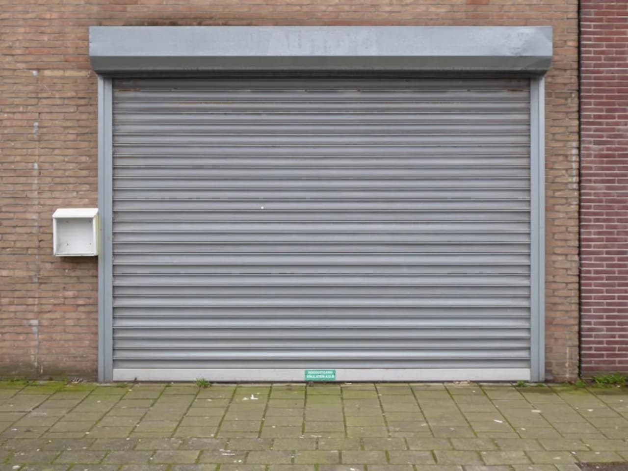Rolling counter-shutter commercial door at a Canadian commercial service window
