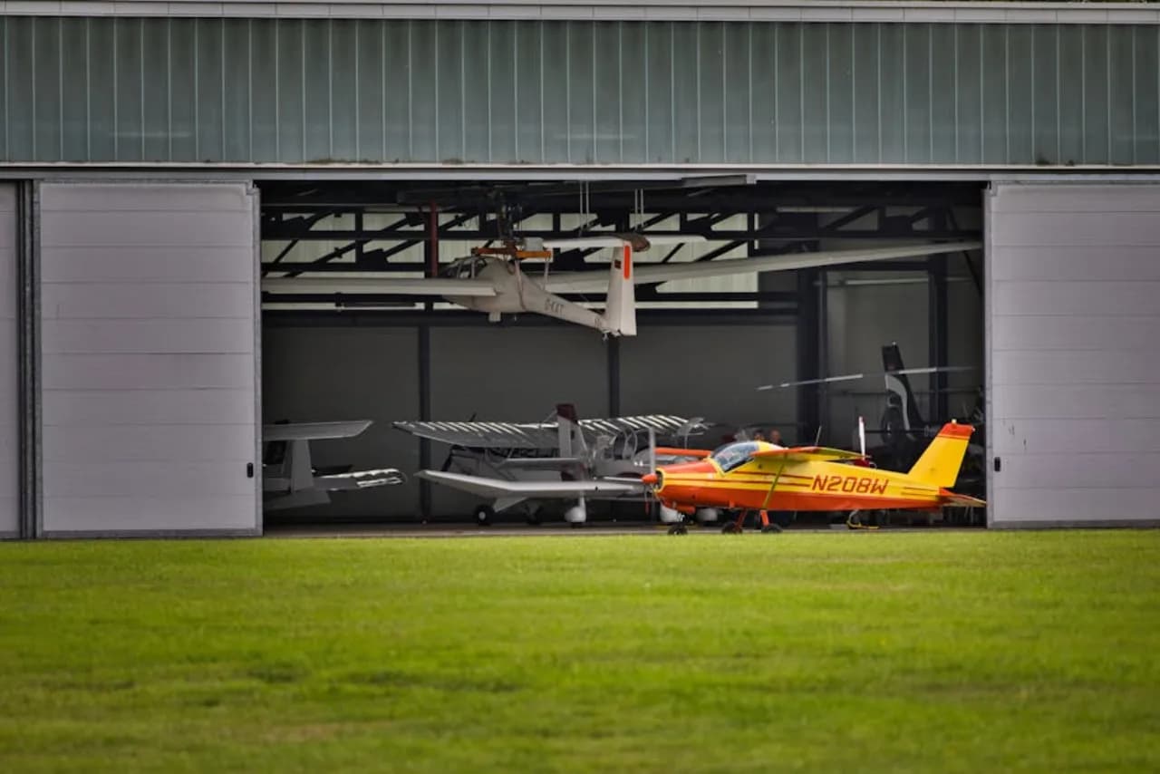 Aircraft hangar commercial door bifold at a Canadian regional airport facility