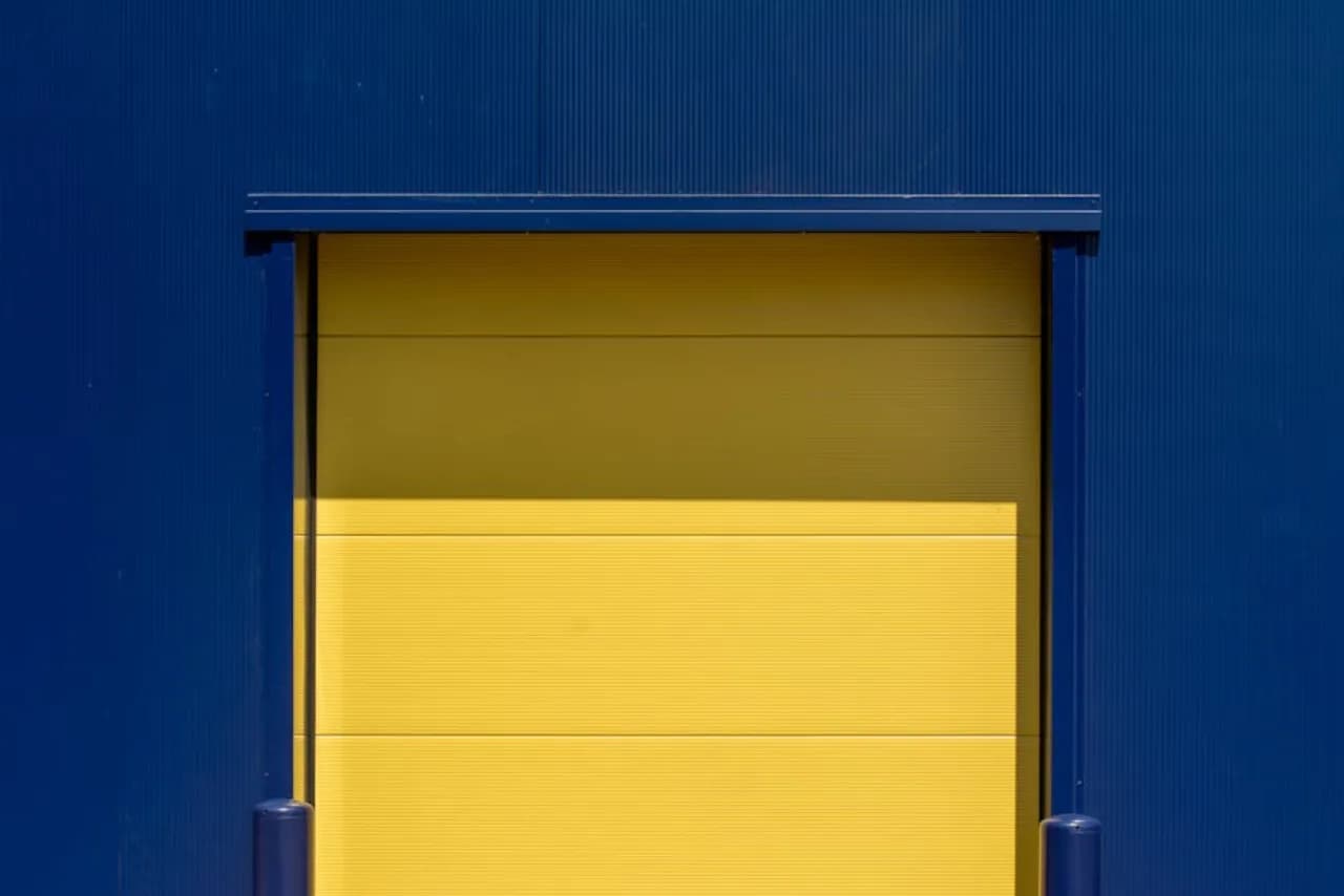 Insulated overhead sectional commercial doors at a Canadian distribution-centre loading bay