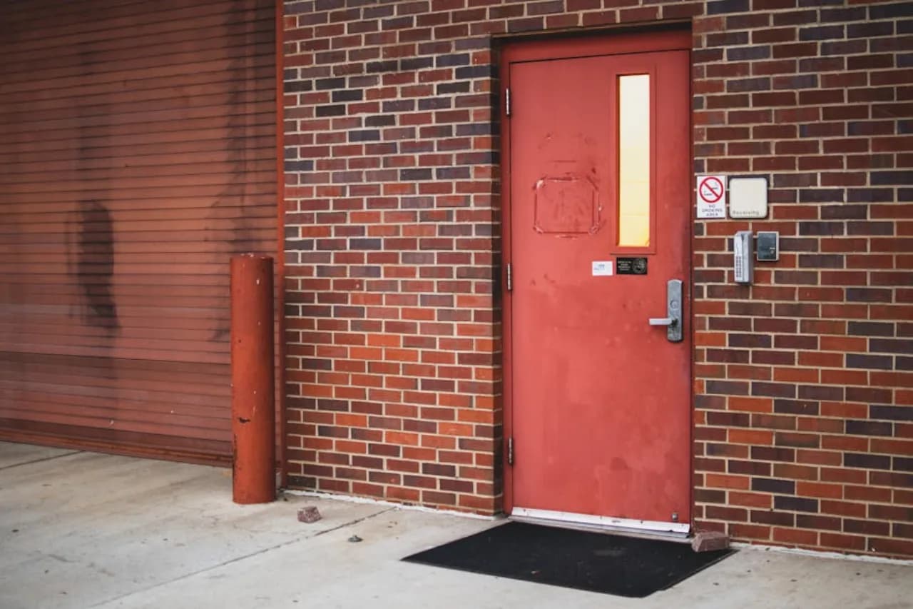 Heavy-gauge security commercial door at a Canadian industrial facility entrance