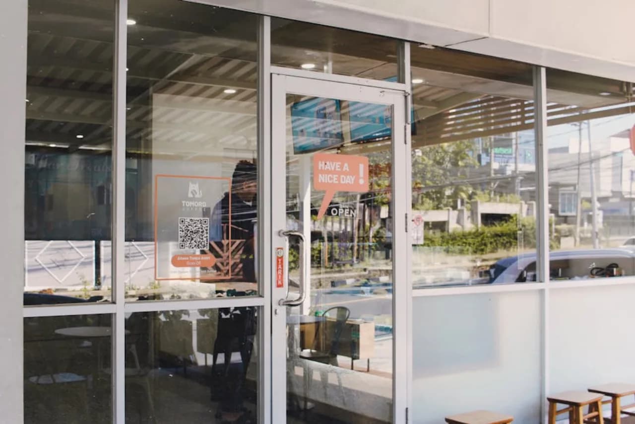 Aluminum-framed storefront commercial door at a Canadian retail building