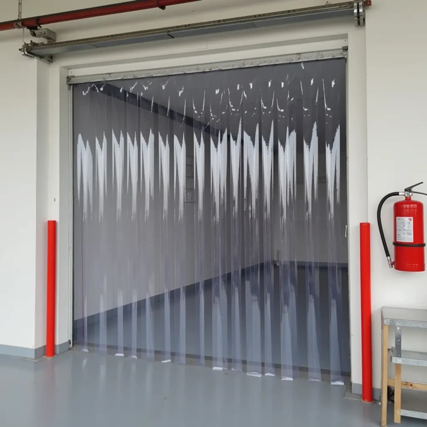 Fire-retardant PVC strip-curtain commercial doorway at a Canadian industrial facility